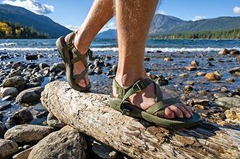 Sports sandals (hiking over log on beach in Chaco sandals)